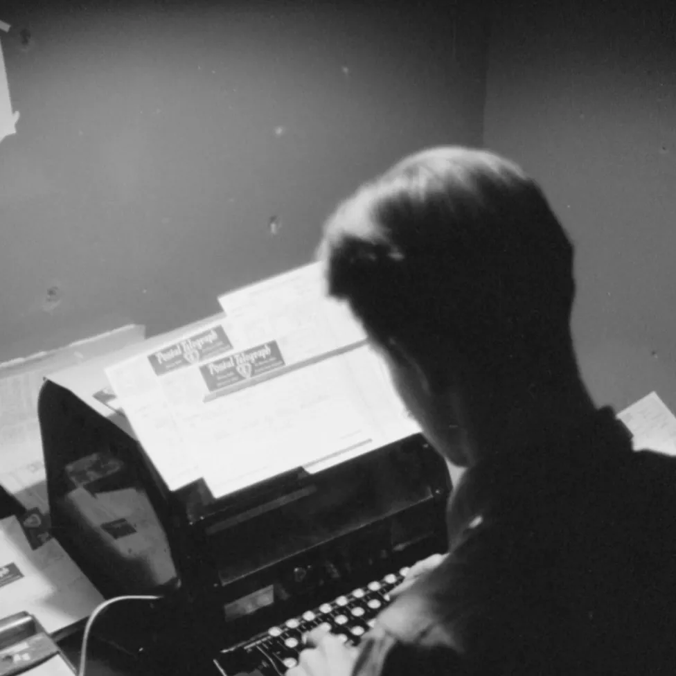 Operations. Optimized. Amplified. OpsVance Picture of a person typing on a typewriter.
